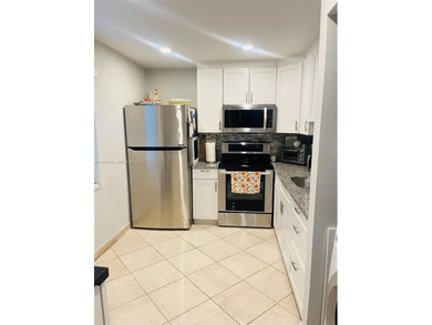 spacious 3-bedroom, 2.5-bath corner unit with 1,760 sq ft in the on Inverrary Country Club in Florida - for sale on GolfHomes.com, golf home, golf lot