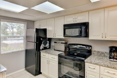 This 1ST FLOOR END UNIT condo with DEEDED COVERED PARKING WITH on Terra Ceia Golf and Country Club in Florida - for sale on GolfHomes.com, golf home, golf lot