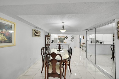 Step into this beautifully updated 55+ condo and immediately on Boca Dunes Golf and Country Club in Florida - for sale on GolfHomes.com, golf home, golf lot