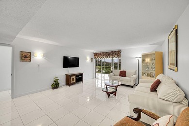 Step into this beautifully updated 55+ condo and immediately on Boca Dunes Golf and Country Club in Florida - for sale on GolfHomes.com, golf home, golf lot