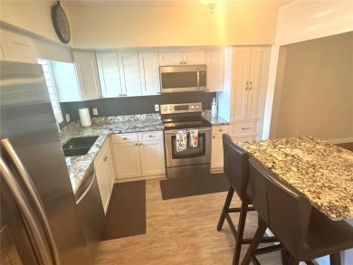 HIGHLY SOUGHT AFTER UPDATED GROUND FLOOR 1415SF CONDO. HIGH-END on On Top Of The World Golf Course in Florida - for sale on GolfHomes.com, golf home, golf lot