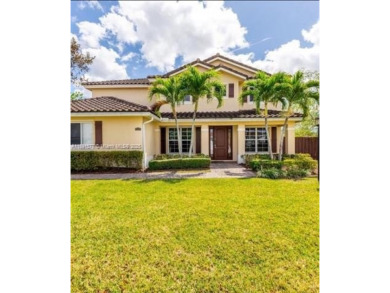 This property is a two-story unit with 3 bed 2.5 bath located in on Country Club of Miami in Florida - for sale on GolfHomes.com, golf home, golf lot
