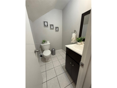 This property is a two-story unit with 3 bed 2.5 bath located in on Country Club of Miami in Florida - for sale on GolfHomes.com, golf home, golf lot