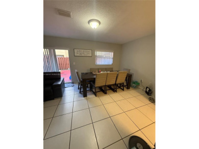 This property is a two-story unit with 3 bed 2.5 bath located in on Country Club of Miami in Florida - for sale on GolfHomes.com, golf home, golf lot