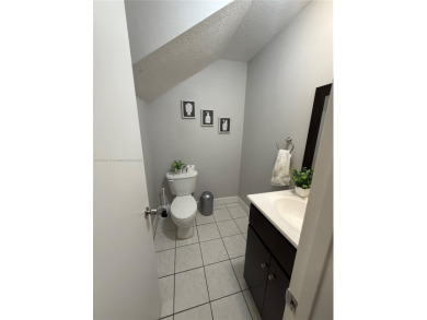 This property is a two-story unit with 3 bed 2.5 bath located in on Country Club of Miami in Florida - for sale on GolfHomes.com, golf home, golf lot