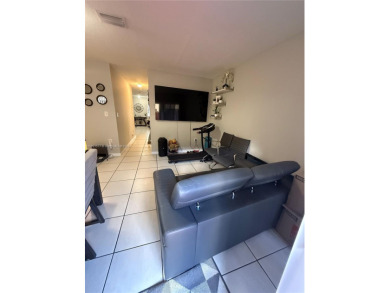 This property is a two-story unit with 3 bed 2.5 bath located in on Country Club of Miami in Florida - for sale on GolfHomes.com, golf home, golf lot