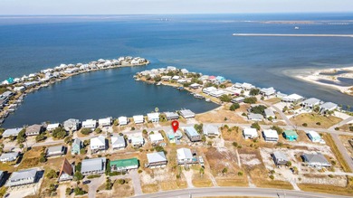 TURN-KEY coastal living with breathtaking water views from every on Isle Dauphine Club Golf Course in Alabama - for sale on GolfHomes.com, golf home, golf lot