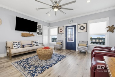 TURN-KEY coastal living with breathtaking water views from every on Isle Dauphine Club Golf Course in Alabama - for sale on GolfHomes.com, golf home, golf lot