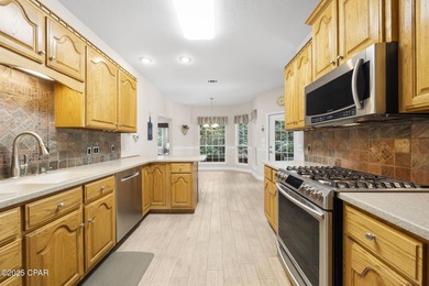 Welcome to 3262 Country Club Drive, a traditional all-brick home on Panama Country Club in Florida - for sale on GolfHomes.com, golf home, golf lot