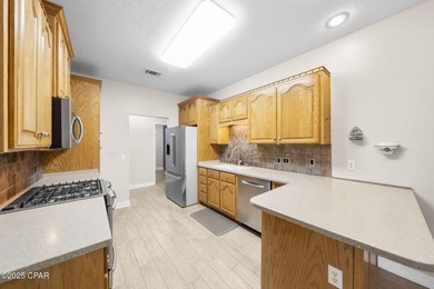 Welcome to 3262 Country Club Drive, a traditional all-brick home on Panama Country Club in Florida - for sale on GolfHomes.com, golf home, golf lot