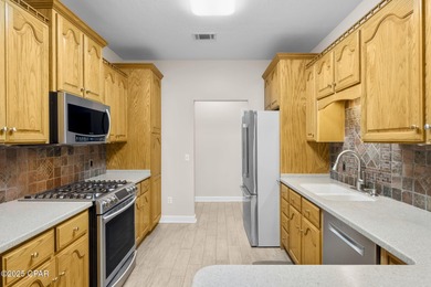 Welcome to 3262 Country Club Drive, a traditional all-brick home on Panama Country Club in Florida - for sale on GolfHomes.com, golf home, golf lot