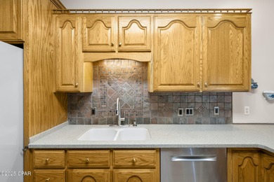 Welcome to 3262 Country Club Drive, a traditional all-brick home on Panama Country Club in Florida - for sale on GolfHomes.com, golf home, golf lot