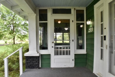 This delightful 3-bedroom, 2-bathroom Craftsman bungalow is on Helena Country Club in Arkansas - for sale on GolfHomes.com, golf home, golf lot