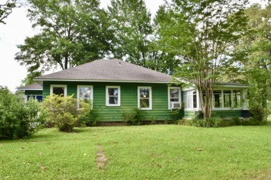 This delightful 3-bedroom, 2-bathroom Craftsman bungalow is on Helena Country Club in Arkansas - for sale on GolfHomes.com, golf home, golf lot