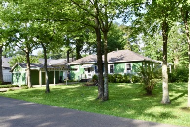 This delightful 3-bedroom, 2-bathroom Craftsman bungalow is on Helena Country Club in Arkansas - for sale on GolfHomes.com, golf home, golf lot