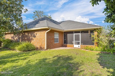 Welcome to 3262 Country Club Drive, a traditional all-brick home on Panama Country Club in Florida - for sale on GolfHomes.com, golf home, golf lot