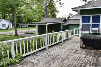 This delightful 3-bedroom, 2-bathroom Craftsman bungalow is on Helena Country Club in Arkansas - for sale on GolfHomes.com, golf home, golf lot