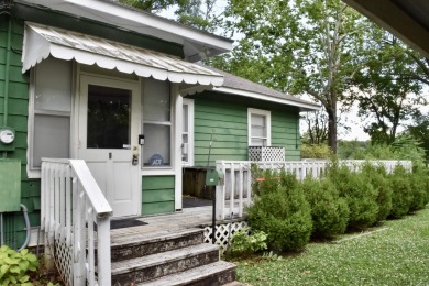 This delightful 3-bedroom, 2-bathroom Craftsman bungalow is on Helena Country Club in Arkansas - for sale on GolfHomes.com, golf home, golf lot