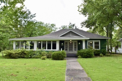 This delightful 3-bedroom, 2-bathroom Craftsman bungalow is on Helena Country Club in Arkansas - for sale on GolfHomes.com, golf home, golf lot