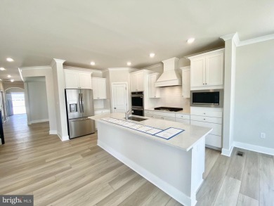 MOVE IN READY-FINISHED BASEMENT AND UPPER LEVEL!  Photos are of on Plantation Lakes Golf and Country Club in Delaware - for sale on GolfHomes.com, golf home, golf lot