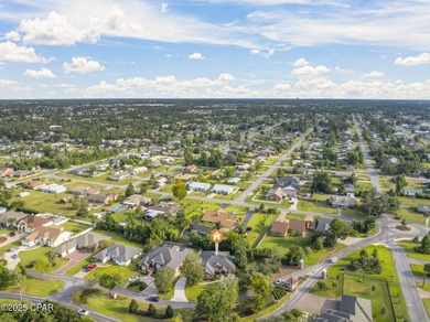 Welcome to 3262 Country Club Drive, a traditional all-brick home on Panama Country Club in Florida - for sale on GolfHomes.com, golf home, golf lot