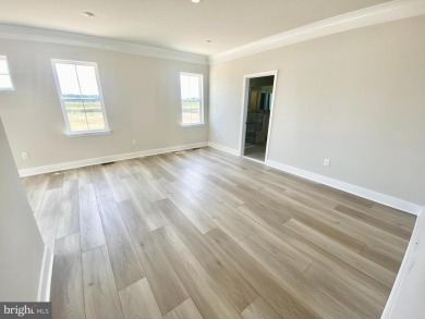 MOVE IN READY-FINISHED BASEMENT AND UPPER LEVEL!  Photos are of on Plantation Lakes Golf and Country Club in Delaware - for sale on GolfHomes.com, golf home, golf lot
