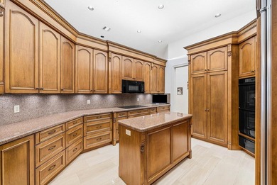 Welcome home to this sprawling executive estate in the exclusive on Bocaire Country Club in Florida - for sale on GolfHomes.com, golf home, golf lot