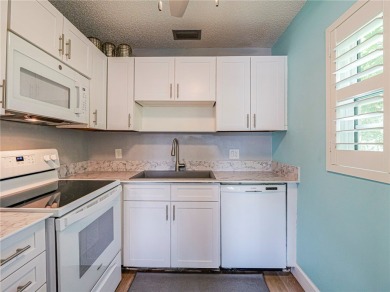 First Floor! Beautiful plank laminate floors w/ newer baseboard on Vero Beach South Golf Course in Florida - for sale on GolfHomes.com, golf home, golf lot