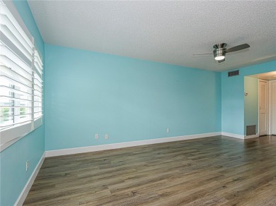 First Floor! Beautiful plank laminate floors w/ newer baseboard on Vero Beach South Golf Course in Florida - for sale on GolfHomes.com, golf home, golf lot