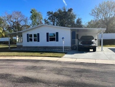 Welcome to this stunning, furnished, move-in-ready manufactured on Riviera Country Club in Florida - for sale on GolfHomes.com, golf home, golf lot