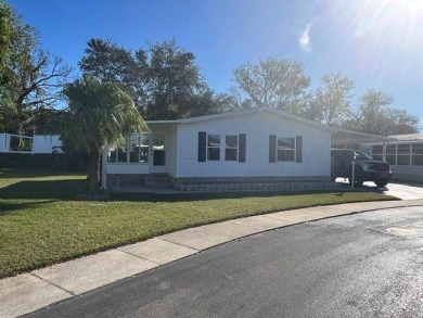 Welcome to this stunning, furnished, move-in-ready manufactured on Riviera Country Club in Florida - for sale on GolfHomes.com, golf home, golf lot