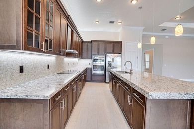 Stunning PGA Verano Pool Home with expansive water views. The on PGA Golf Club in PGA Village in Florida - for sale on GolfHomes.com, golf home, golf lot