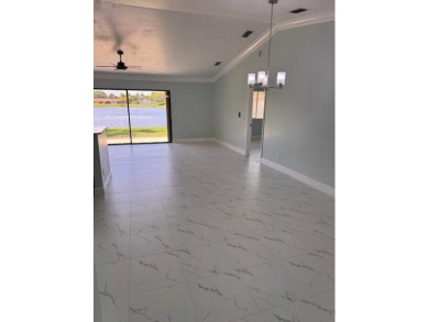 EXPERIENCE LAKEFRONT VIEWS AT THEIR BEST IN THIS impeccable on High Ridge Country Club in Florida - for sale on GolfHomes.com, golf home, golf lot