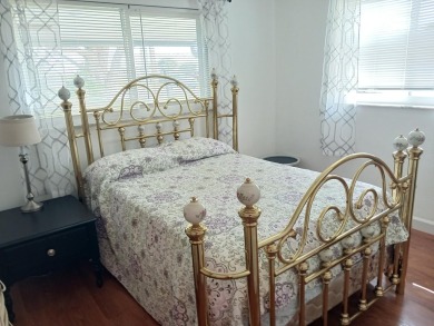 Fall in love with this 2Br/2Ba corner villa is ideally located on Leisureville Community Golf Course in Florida - for sale on GolfHomes.com, golf home, golf lot
