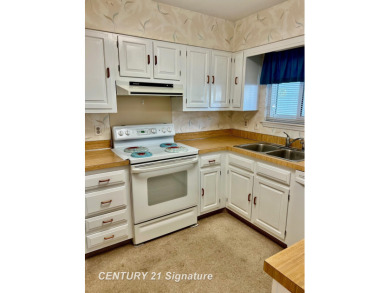 Enjoy easy living in this 2-bedroom, 2-full-bath condo perfectly on Swan Valley Golf Club in Michigan - for sale on GolfHomes.com, golf home, golf lot