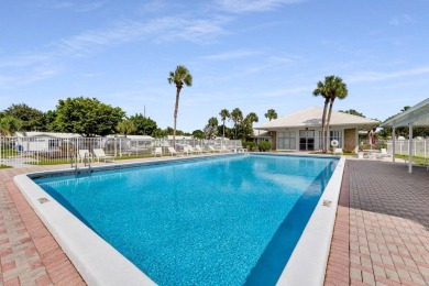 Fall in love with this 2Br/2Ba corner villa is ideally located on Leisureville Community Golf Course in Florida - for sale on GolfHomes.com, golf home, golf lot