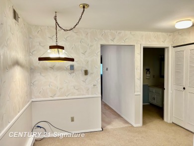 Enjoy easy living in this 2-bedroom, 2-full-bath condo perfectly on Swan Valley Golf Club in Michigan - for sale on GolfHomes.com, golf home, golf lot