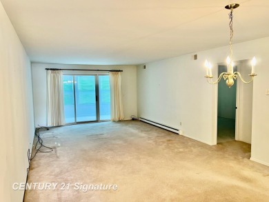 Enjoy easy living in this 2-bedroom, 2-full-bath condo perfectly on Swan Valley Golf Club in Michigan - for sale on GolfHomes.com, golf home, golf lot