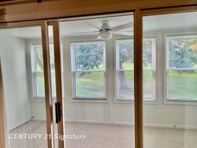 Enjoy easy living in this 2-bedroom, 2-full-bath condo perfectly on Swan Valley Golf Club in Michigan - for sale on GolfHomes.com, golf home, golf lot