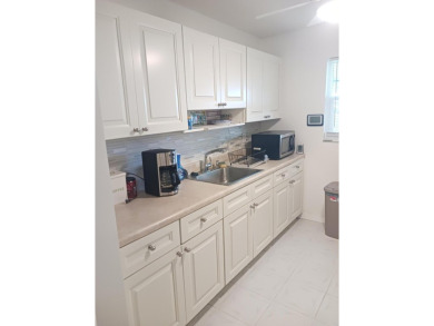 Fall in love with this 2Br/2Ba corner villa is ideally located on Leisureville Community Golf Course in Florida - for sale on GolfHomes.com, golf home, golf lot