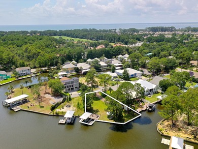 Positioned along Buck Bayou in the heart of Santa Rosa Beach, 83 on Sandestin Golf and Beach Resort - Raven in Florida - for sale on GolfHomes.com, golf home, golf lot