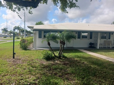 Fall in love with this 2Br/2Ba corner villa is ideally located on Leisureville Community Golf Course in Florida - for sale on GolfHomes.com, golf home, golf lot