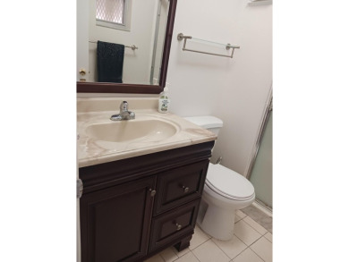 Fall in love with this 2Br/2Ba corner villa is ideally located on Leisureville Community Golf Course in Florida - for sale on GolfHomes.com, golf home, golf lot