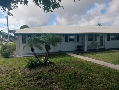 Fall in love with this 2Br/2Ba corner villa is ideally located on Leisureville Community Golf Course in Florida - for sale on GolfHomes.com, golf home, golf lot