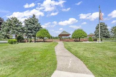 Incredible end unit ranch overlooking the pond and pier in this on St. Clair Shores Country Club in Michigan - for sale on GolfHomes.com, golf home, golf lot