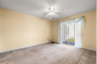 This great first floor end unit, with a large screened in back on Palmetto Greens Golf and Country Club in South Carolina - for sale on GolfHomes.com, golf home, golf lot