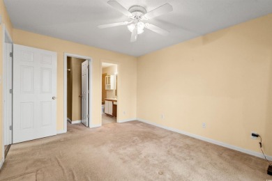 This great first floor end unit, with a large screened in back on Palmetto Greens Golf and Country Club in South Carolina - for sale on GolfHomes.com, golf home, golf lot