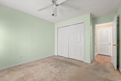 This great first floor end unit, with a large screened in back on Palmetto Greens Golf and Country Club in South Carolina - for sale on GolfHomes.com, golf home, golf lot
