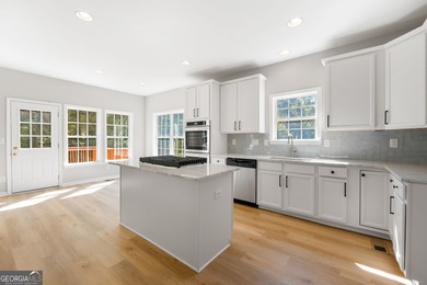 Welcome home to this stunning 3-story brick residence in the on Canongate At Heron Bay in Georgia - for sale on GolfHomes.com, golf home, golf lot
