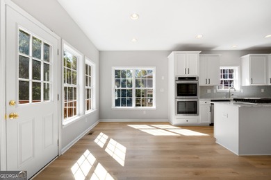 Welcome home to this stunning 3-story brick residence in the on Canongate At Heron Bay in Georgia - for sale on GolfHomes.com, golf home, golf lot